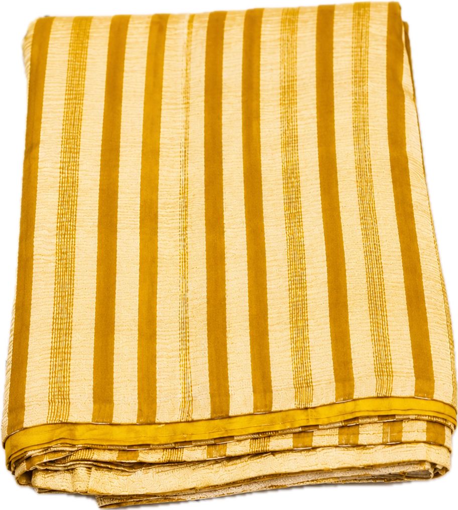 Folded yellow and white striped fabric on a white background